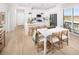 Bright kitchen featuring white cabinets, stainless steel appliances, and a breakfast bar at 21104 E 63Rd Dr, Aurora, CO 80019