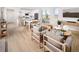 Open-concept living and dining area with modern furnishings, and plenty of natural light at 21104 E 63Rd Dr, Aurora, CO 80019