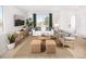 Cozy living area with comfortable seating, stylish decor, and a large window at 21104 E 63Rd Dr, Aurora, CO 80019