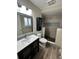 Modern bathroom featuring a shower, toilet, vanity and modern finishes at 3038 S Xenia Ct, Denver, CO 80231