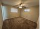 Bedroom featuring a ceiling fan and plush carpeting at 3038 S Xenia Ct, Denver, CO 80231