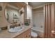 Well-lit bathroom featuring a bath, vanity, neutral walls, updated sink and faucet at 8450 Everett Way # D, Arvada, CO 80005