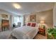 Cozy bedroom featuring comfortable furniture, natural light, and warm decor at 8450 Everett Way # D, Arvada, CO 80005