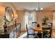 Bright dining room with hardwood floors, natural light, and elegant furnishings at 8450 Everett Way # D, Arvada, CO 80005