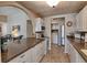Kitchen with ample counter space, laundry area, and stainless steel refrigerator at 8450 Everett Way # D, Arvada, CO 80005