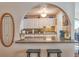 Well-designed kitchen with white cabinets, granite countertops, and stylish backsplash at 8450 Everett Way # D, Arvada, CO 80005