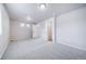 Large bedroom features neutral carpet, white walls, and views into the adjacent bathroom at 46561 Avery Ln, Bennett, CO 80102