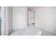 Bright bedroom with gray carpet and sliding door closet at 46561 Avery Ln, Bennett, CO 80102