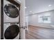 Laundry closet with a Whirlpool stackable washer and dryer at 46561 Avery Ln, Bennett, CO 80102
