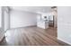 Bright and airy living space features contemporary wood flooring, recessed lighting, and a convenient kitchen island at 46561 Avery Ln, Bennett, CO 80102