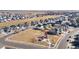 Aerial view showcasing a Gathering-friendly community, local park, and playground at 10976 Lewiston St, Commerce City, CO 80022
