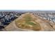 Aerial view of community bordering a golf course, providing a scenic backdrop for residents at 10976 Lewiston St, Commerce City, CO 80022