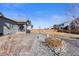 Private backyard featuring a stone patio perfect for entertaining or relaxing and low maintenance landscaping at 10976 Lewiston St, Commerce City, CO 80022