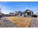 Spacious, private backyard featuring a patio, green space, and tasteful landscaping, perfect for relaxation or entertaining at 10976 Lewiston St, Commerce City, CO 80022