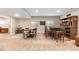 Finished basement boasting a bar with barstool seating, dining table, and neutral walls at 10976 Lewiston St, Commerce City, CO 80022