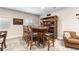 Finished basement featuring a custom bar, stools, shelves with drinks, and an armchair at 10976 Lewiston St, Commerce City, CO 80022