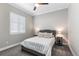 Cozy bedroom featuring neutral colors, a bright window, and soft carpet flooring at 10976 Lewiston St, Commerce City, CO 80022