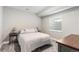 Cozy bedroom with a queen bed, neutral walls, carpet, and a window with blinds at 10976 Lewiston St, Commerce City, CO 80022