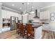 Modern kitchen with stainless steel appliances, island seating, and plenty of cabinet space at 10976 Lewiston St, Commerce City, CO 80022