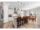 Modern kitchen with sleek stainless steel appliances and adjacent dining area at 10976 Lewiston St, Commerce City, CO 80022