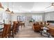 Open living room featuring seamless flow to dining area and hardwood flooring at 10976 Lewiston St, Commerce City, CO 80022