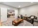 Neutral living room showcasing comfortable armchairs, neutral walls, and a gray carpet at 10976 Lewiston St, Commerce City, CO 80022