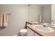 Simple bathroom showcasing a sink, toilet, and large mirror, providing a practical and functional space at 601 Clarendon Loop, Castle Pines, CO 80108