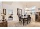 Inviting dining room with pendant lighting conveniently located next to a bedroom and the kitchen at 601 Clarendon Loop, Castle Pines, CO 80108