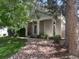 Beautiful single-story home with a covered front porch, stone accents, and well-maintained landscaping at 601 Clarendon Loop, Castle Pines, CO 80108