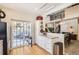 Well-lit kitchen flows to the dining area and showcases a sliding door to an outdoor deck at 601 Clarendon Loop, Castle Pines, CO 80108