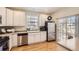 Bright and functional kitchen equipped with stainless steel appliances and a sliding glass door to the outside at 601 Clarendon Loop, Castle Pines, CO 80108