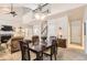 Spacious living and dining areas feature a fireplace, vaulted ceilings, and an open staircase to the second floor at 601 Clarendon Loop, Castle Pines, CO 80108
