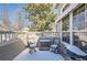 Outdoor patio with seating, featuring a grill and railing with a view of trees at 601 Clarendon Loop, Castle Pines, CO 80108
