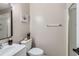 Compact bathroom with a walk-in shower and decorative plants above the toilet, offering a blend of functionality and style at 7912 S Depew St # A, Littleton, CO 80128