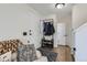 Bright foyer with hardwood floors, a coat rack, and a comfortable seating area near the entrance at 7912 S Depew St # A, Littleton, CO 80128