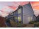 Charming multi-level home featuring tidy landscaping, a columned front porch, and muted siding at 7912 S Depew St # A, Littleton, CO 80128