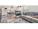 Inviting living area featuring a modern fireplace, hardwood floors, and natural light at 7912 S Depew St # A, Littleton, CO 80128