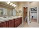 Double vanity bathroom with a large walk-in closet at 26175 E Fair Pl, Centennial, CO 80016