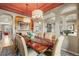 Elegant dining room featuring a large table and chandelier at 26175 E Fair Pl, Centennial, CO 80016