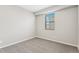 Comfortable bedroom with neutral carpet, a window for natural light, and ample space at 9376 Yampa Ct, Commerce City, CO 80022