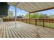 Spacious wooden deck overlooking a grassy backyard at 4562 S Gar Way, Littleton, CO 80123