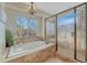 Luxurious bathroom featuring a soaking tub with a view and a separate glass-enclosed shower at 18885 E Union Dr, Aurora, CO 80015