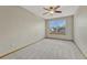 Inviting bedroom with a large window, neutral walls, and plush carpeting at 18885 E Union Dr, Aurora, CO 80015