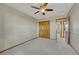Comfortable bedroom with a ceiling fan, closet and neutral walls at 18885 E Union Dr, Aurora, CO 80015