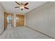 Bedroom featuring neutral walls, closet, and a ceiling fan at 18885 E Union Dr, Aurora, CO 80015