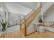 Bright entryway with hardwood floors and a staircase leading to the second floor at 18885 E Union Dr, Aurora, CO 80015