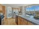 Bright kitchen featuring stainless steel appliances, granite counters, and a breakfast nook with scenic views at 18885 E Union Dr, Aurora, CO 80015