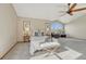 Spacious main bedroom with large windows, neutral carpet, and a comfortable seating area at 18885 E Union Dr, Aurora, CO 80015