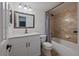 Bathroom featuring a shower and tub combination, decorative tile surround, and modern vanity at 3332 S Ammons St # 103, Lakewood, CO 80227