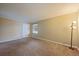 Comfortable bedroom with a large window, plush carpet, and ample natural light at 3332 S Ammons St # 103, Lakewood, CO 80227